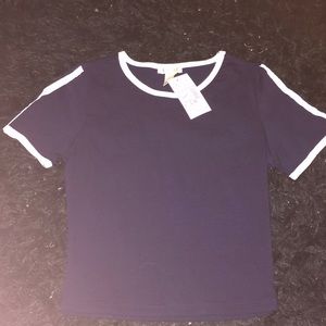 A navy blue shirt with lines on sleeves